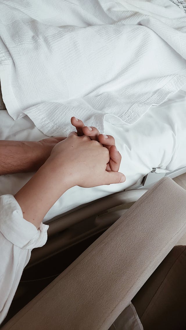a heartwarming touch of a hand as part of hospice care